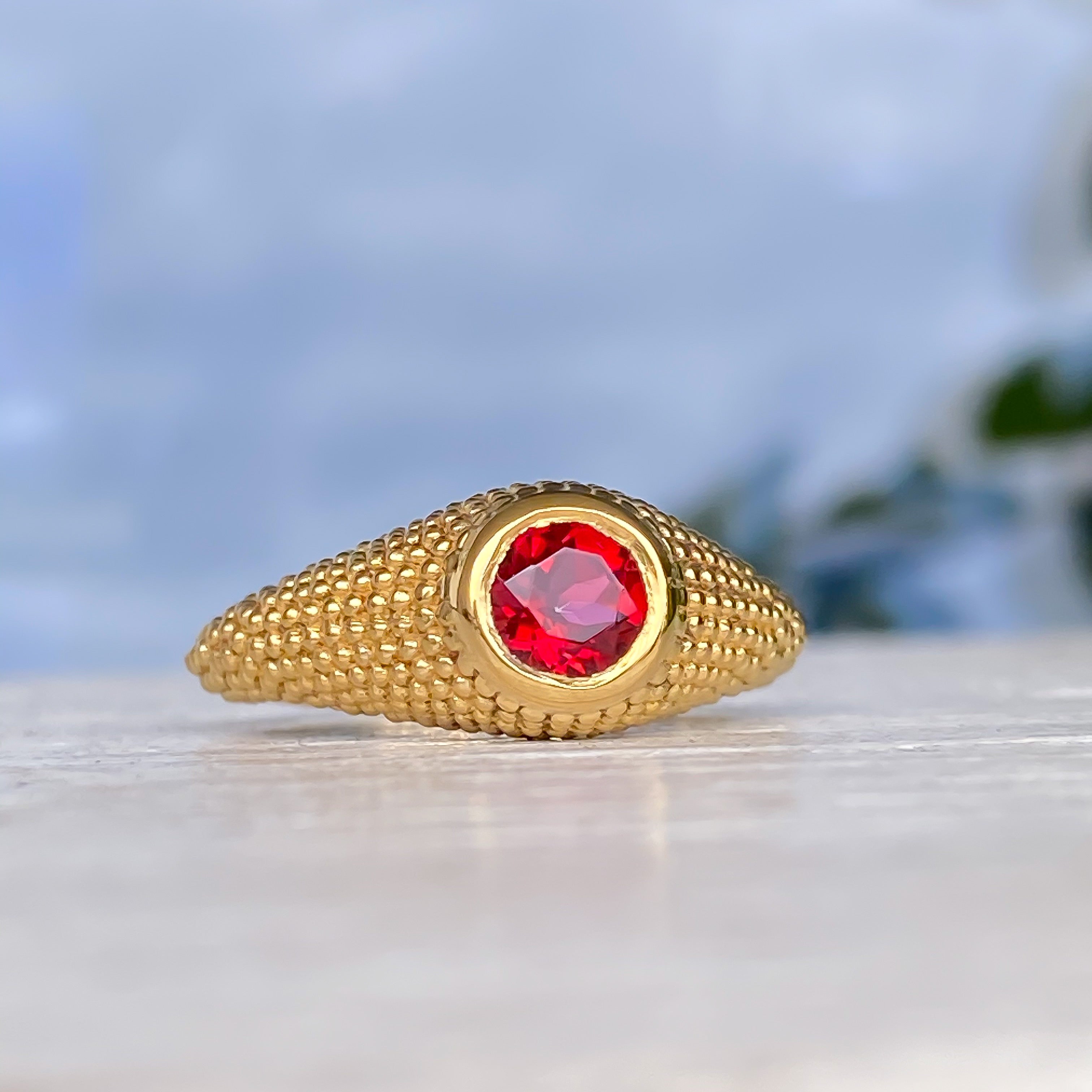 Bague Nubia en or jaune et topaze rouge ronde, taille 7,5 US